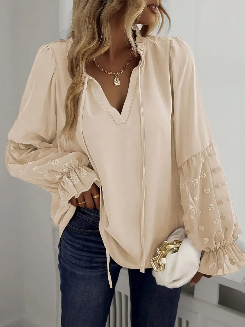 Nemirra – Stijlvolle, half doorschijnende blouse met franje