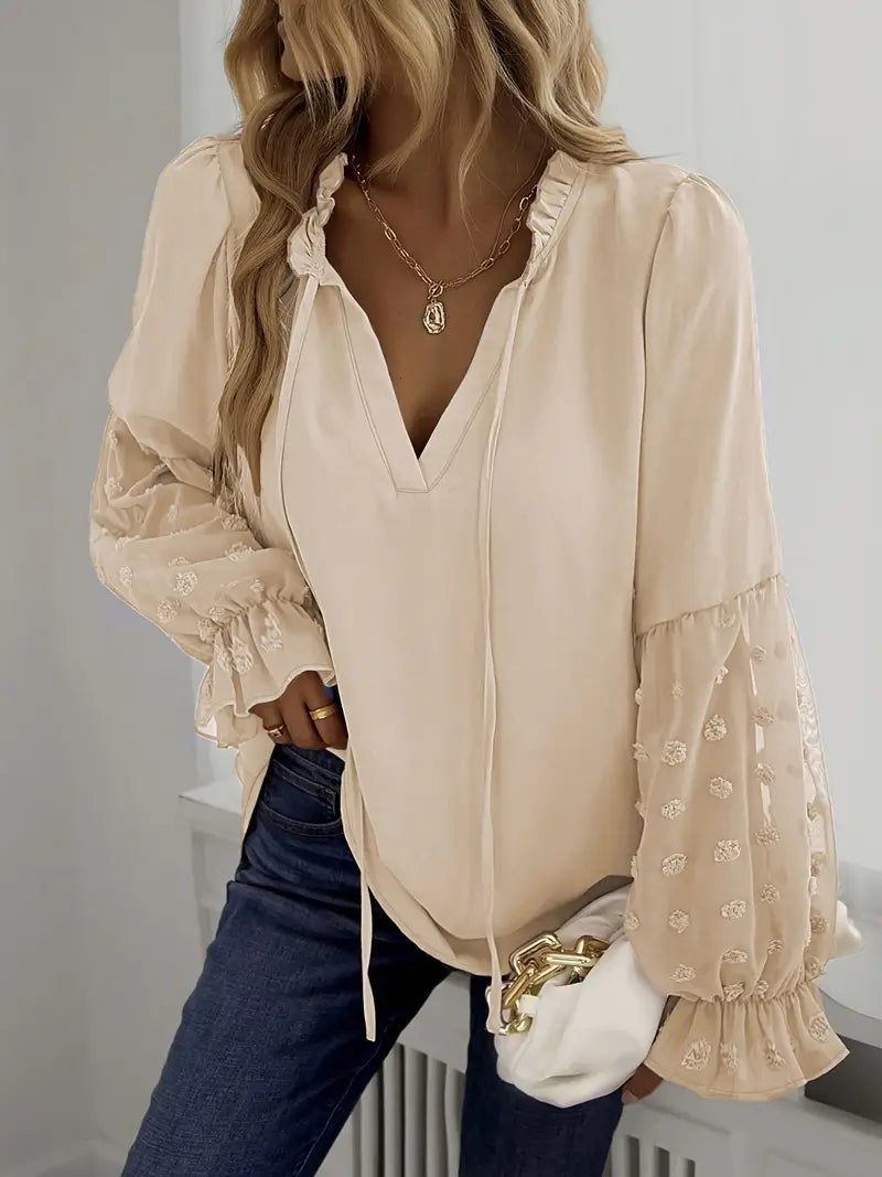 Nemirra – Stijlvolle, half doorschijnende blouse met franje